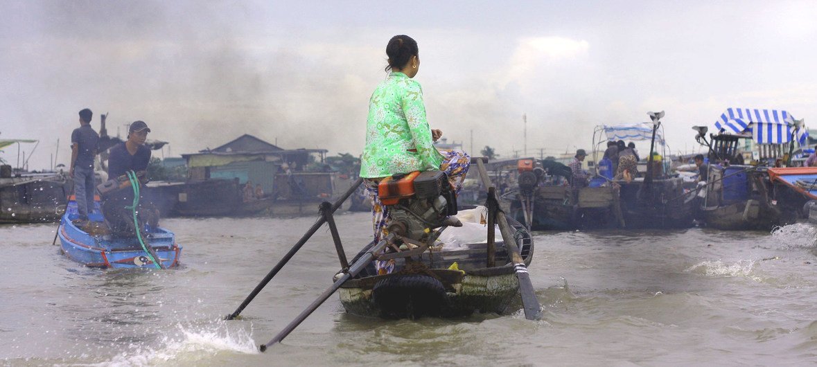 A woman boat-driver in Mekong Delta, Vietnam. (23 July 2014)