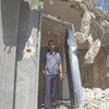 A man stands in what remains of his house in the West Bank after its demolition by the Israeli authorities in September 2018.