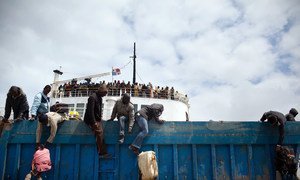 Third Country Nationals unload baggage from an IOM ship as the boat docks in Libya's Benghazi port. (File)  