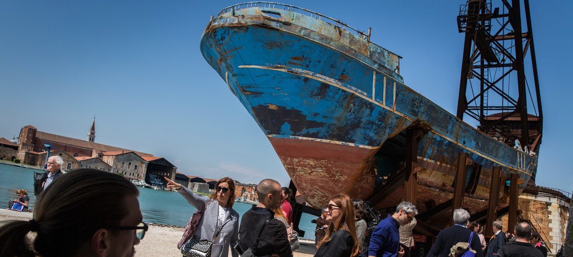 A boat in which 800 migrants and refugees died in the Mediterranean sea, goes on display at the Venice Biennale, in Venice, Italy.