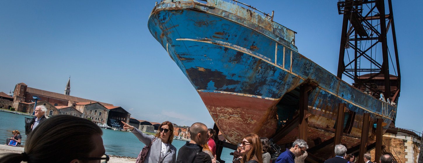 A boat in which 800 migrants and refugees died in the Mediterranean sea, goes on display at the Venice Biennale, in Venice, Italy.