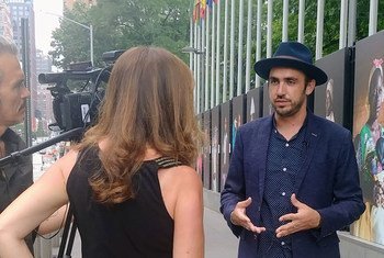UN News interviews OCHA photographer Vincent Tremeau at the opening of the exhibition One Day, I Will.